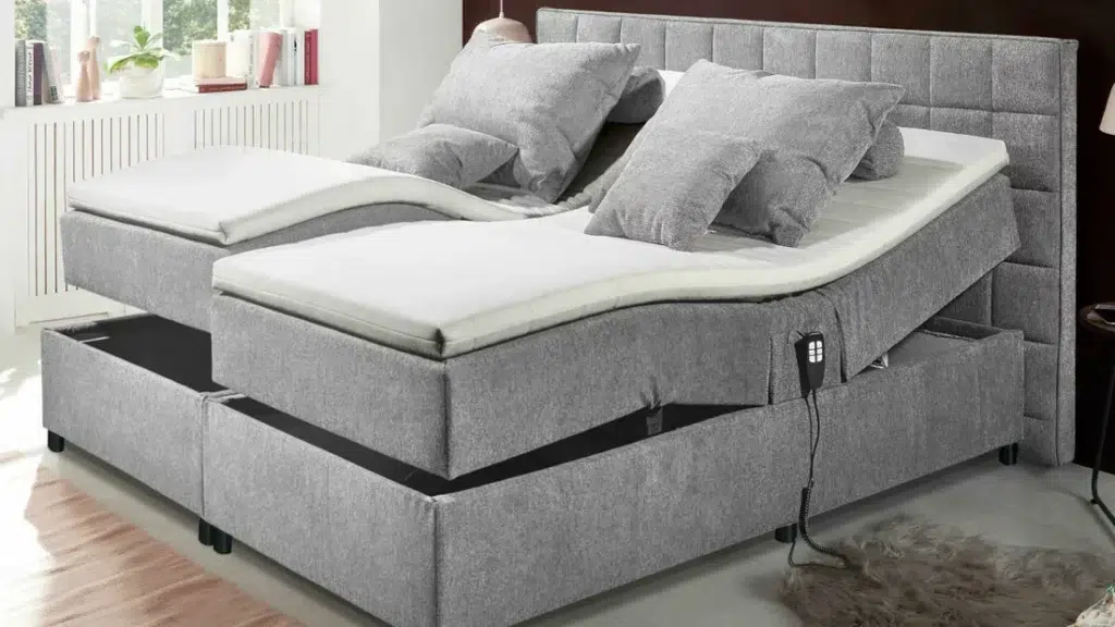 Graues Boxspringbett mit Motor